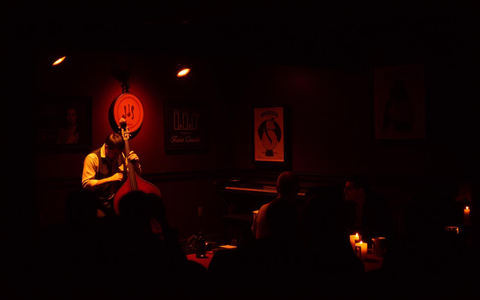 A quartet playing to candlelit tables